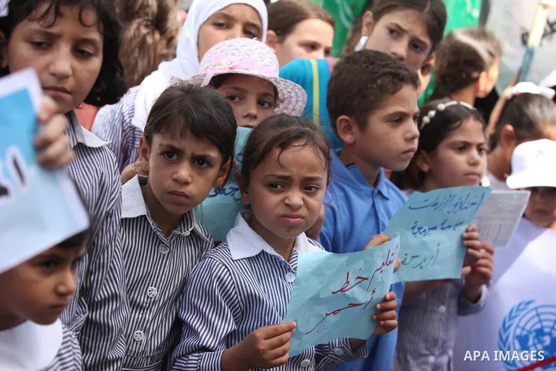 Palestinian women take part in a protest against possible reductions of the services and aid offered by United Nations Relief and Works Agency (UNRWA), in front of UNRWA headquarters in Gaza City August 16, 2015. Photo b...