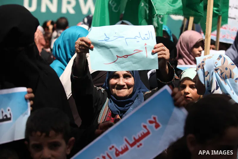 Palestinian women take part in a protest against possible reductions of the services and aid offered by United Nations Relief and Works Agency (UNRWA), in front of UNRWA headquarters in Gaza City August 16, 2015. Photo b...