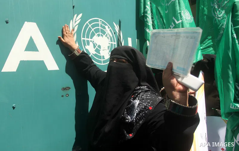 Palestinian women take part in a protest against possible reductions of the services and aid offered by United Nations Relief and Works Agency (UNRWA), in front of UNRWA headquarters in Gaza City August 16, 2015. Photo b...
