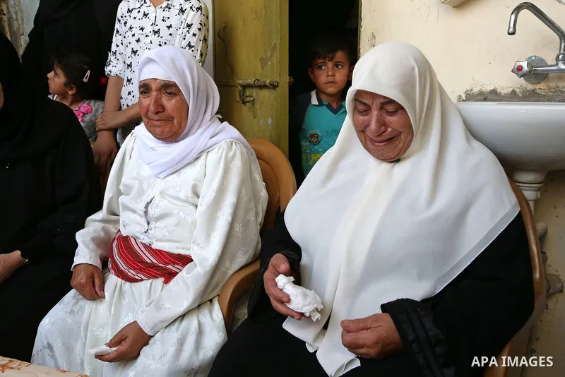 Relatives mourn during the funeral of 21-year-old Rafiq Taj, a Palestinian who was shot dead by Israeli forces after stabbing an Israeli border policeman, on August 16, 2015 near the West Bank village of Tubas in the nor...