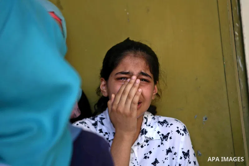 A relatives mourns during the funeral of 21-year-old Rafiq Taj, a Palestinian who was shot dead by Israeli forces after stabbing an Israeli border policeman, on August 16, 2015 near the West Bank village of Tubas in the...