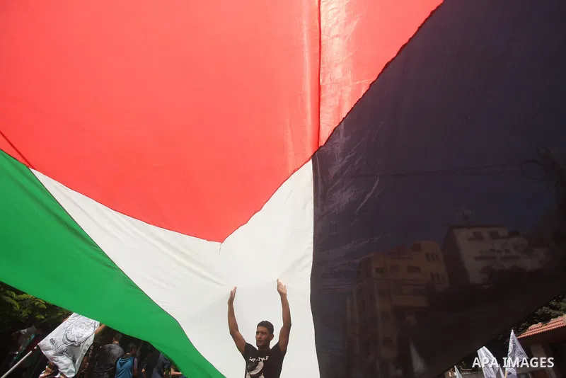 Palestinians hold placards during a protest to show solidarity with prisoner Mohammad Allan allegedly being held in an Israeli jail, in Gaza city on August 19, 2015. The Israeli military prosecutor intends to request cou...
