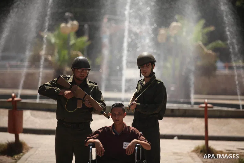 Palestinian youths take part in a theatrical presentation during a protest to show solidarity with prisoner Mohammad Allan allegedly being held in an Israeli jail, in Gaza city on August 19, 2015. The Israeli military pr...