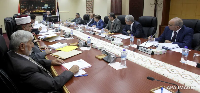Palestinian Prime Minister Rami Hamdallah chairs a meeting of Council of Ministers in the West Bank city of Ramallah on August 18, 2015. Photo by Prime Minister Office