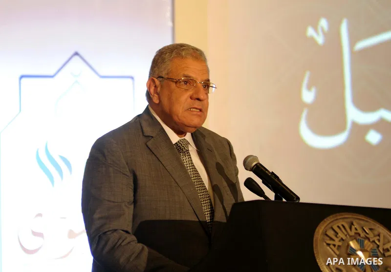 Egypt's Prime Minister Ibrahim Mahlab attends the Fatwa conference organised by Dar al-Ifta, in cairo on August 18, 2015. Egypt's Dar al-Ifta held a two-day international Fatwa conference to counter radical extremism ent...