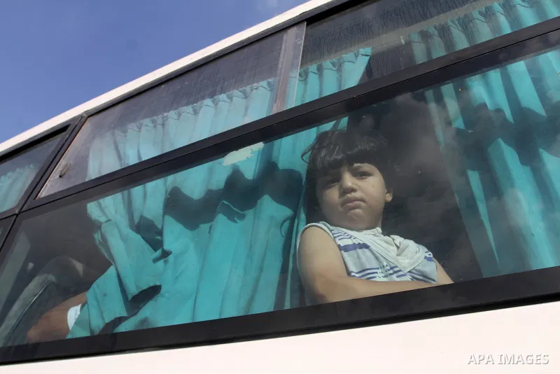 Palestinians wait for travel permits to cross into Egypt at the Rafah border crossing between Egypt and the southern Gaza Strip August 19, 2015. Egypt opened the Rafah border crossing on Monday for four days to allow Pal...