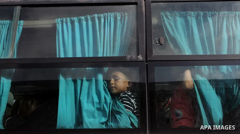 Palestinians wait for travel permits to cross into Egypt at the Rafah border crossing between Egypt and the southern Gaza Strip August 19, 2015. Egypt opened the Rafah border crossing on Monday for four days to allow Pal...