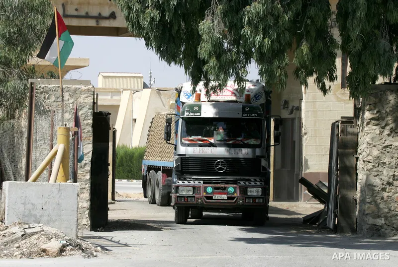 A truck loded with cement enters from Egypt through the Rafah border crossing in southern Gaza Strip, August 20, 2015. The authorities in Egypt have allowed 1,000 tons of cement and 166 tons of gravel to cross the border...