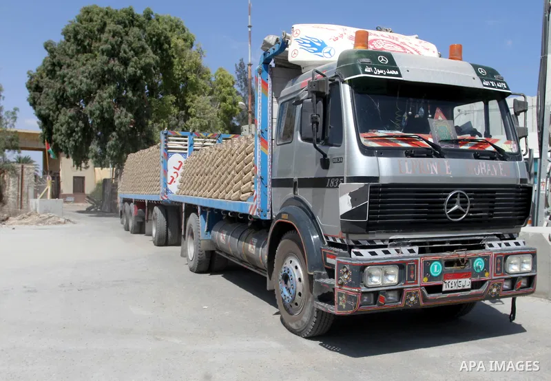A truck loded with cement enters from Egypt through the Rafah border crossing in southern Gaza Strip, August 20, 2015. The authorities in Egypt have allowed 1,000 tons of cement and 166 tons of gravel to cross the border...