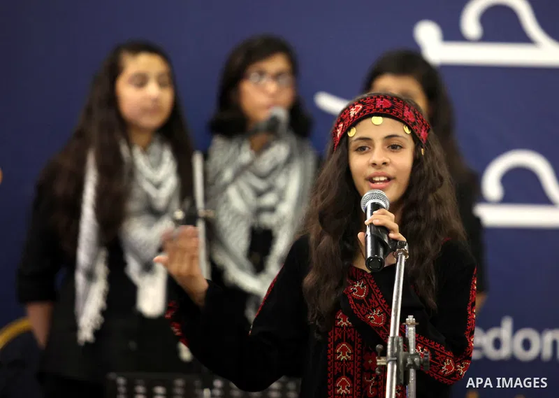Palestinian members of musical band from "Edward Said National Conservatory of Music" perform in a festival of "Sea and Freedom" in Gaza city on August 22, 2015. Photo by Ashraf Amra