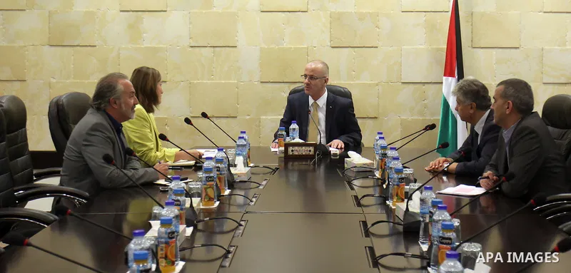 Palestinian Prime Minister Rami Hamdallah meets with ILO expert in Social Security, Ms. Ursula Kolekih, in the West Bank city of Ramallah on August 23, 2015. Photo by Prime Minister Office