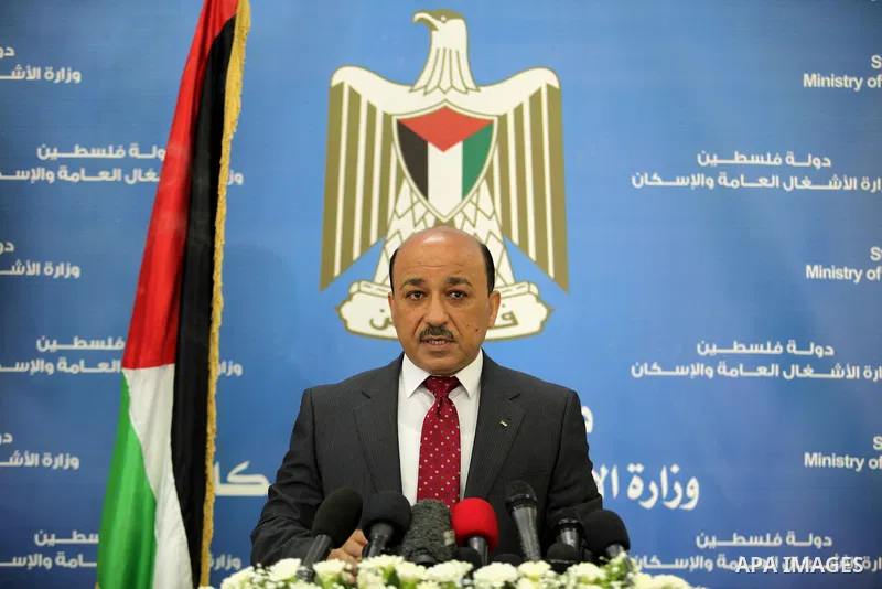 Palestinian housing minister Mufeed al-Hasayna, speaks during a press conference in Gaza city on August 23, 2015. Photo by Ashraf Amra