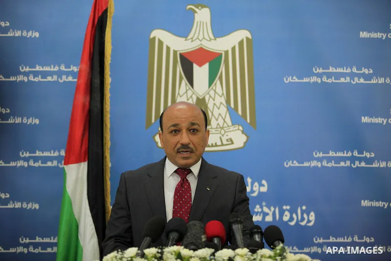 Palestinian housing minister Mufeed al-Hasayna, speaks during a press conference in Gaza city on August 23, 2015. Photo by Ashraf Amra