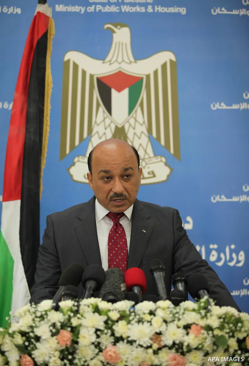 Palestinian housing minister Mufeed al-Hasayna, speaks during a press conference in Gaza city on August 23, 2015. Photo by Ashraf Amra