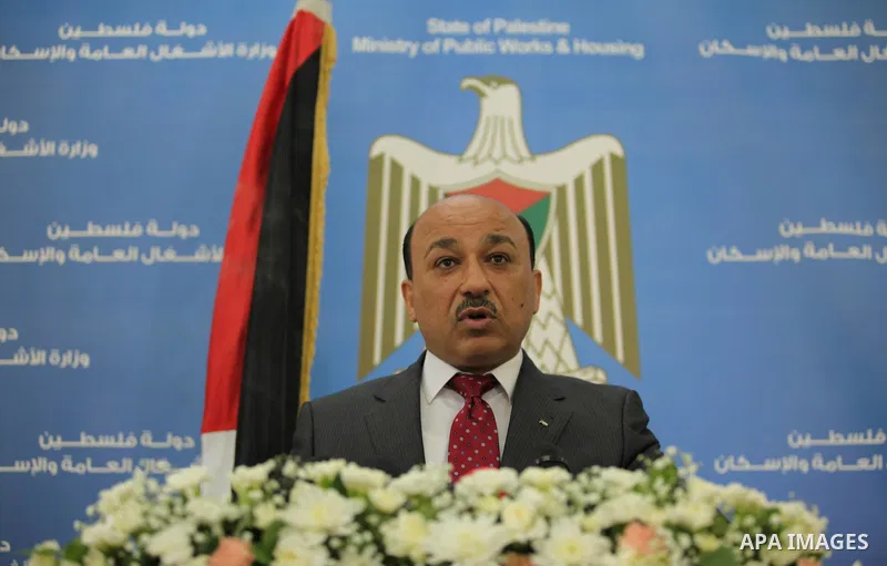 Palestinian housing minister Mufeed al-Hasayna, speaks during a press conference in Gaza city on August 23, 2015. Photo by Ashraf Amra