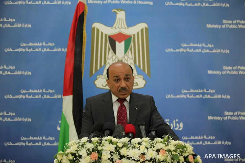Palestinian housing minister Mufeed al-Hasayna, speaks during a press conference in Gaza city on August 23, 2015. Photo by Ashraf Amra