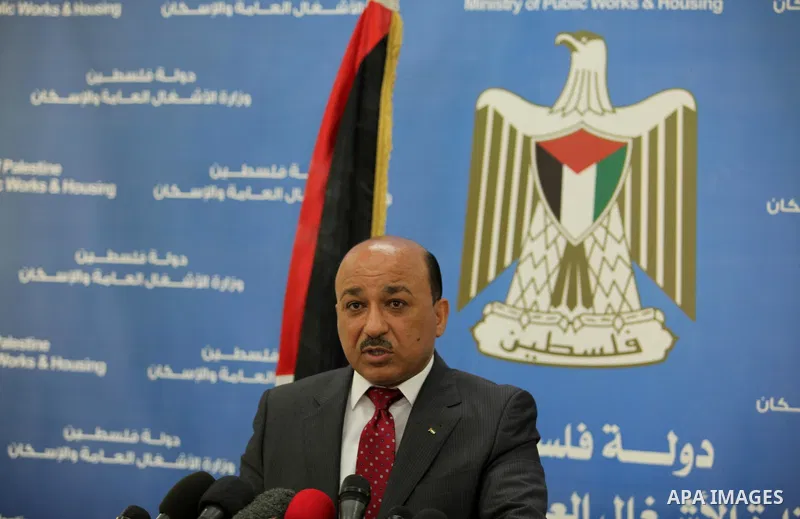 Palestinian housing minister Mufeed al-Hasayna, speaks during a press conference in Gaza city on August 23, 2015. Photo by Ashraf Amra