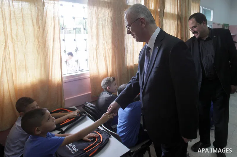 Palestinian Prime Minister Rami Hamdallah visits a school during the first day of the new school year in Duma village near the West Bank city of Nablus, on August 24, 2015. Photo by Prime Minister Office