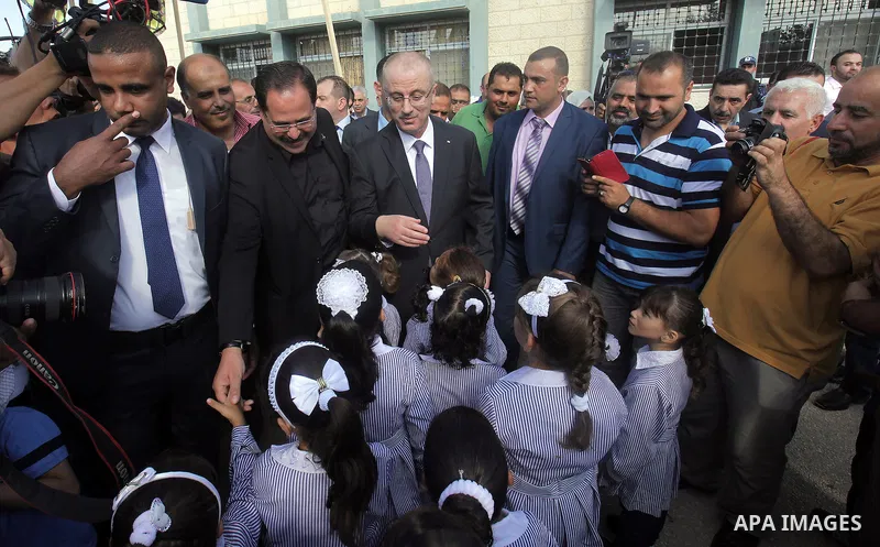 Palestinian Prime Minister Rami Hamdallah visits a school during the first day of the new school year in Duma village near the West Bank city of Nablus, on August 24, 2015. Photo by Prime Minister Office