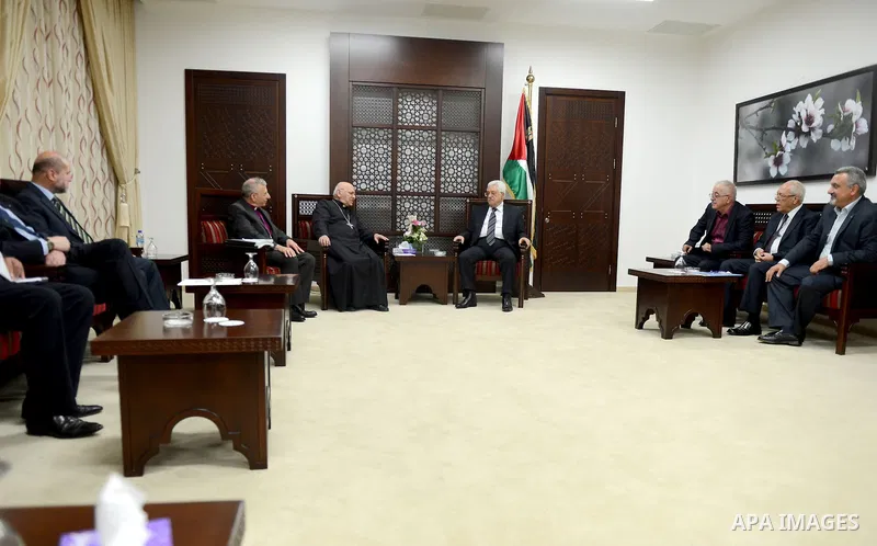 Palestinian President, Mahmoud Abbas (Abu Mazen) meets with a sabah Patriarch and Bishop Munib Younan, in the West Bank city of Ramallah on August 24, 2015. Photo by Osama Falah