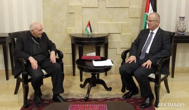 Palestinian Prime Minister Rami Hamdallah meets with Chairman Emeritus Archbishop of Washington Cardinal Theodore McCarrick in the West Bank city of Ramallah, on August 24, 2015. Photo by Prime Minister Office