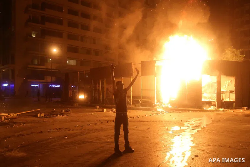 Lebanese protesters clash with riot police following a demonstration, organized by "You Stink" campaign, to protest against the ongoing country's trash crisis in the capital Beirut on August 23, 2015. Demonstrators clash...