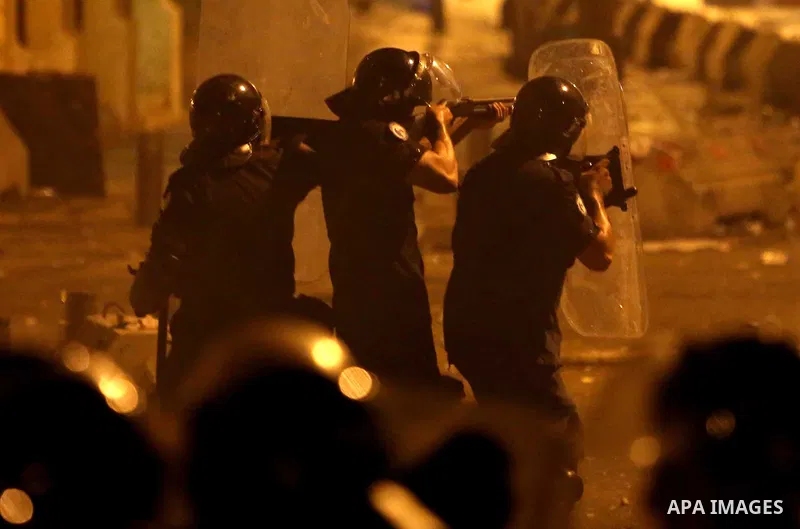 Lebanese riot police take position during clashes with protesters following a demonstration, organized by "You Stink" campaign, to protest against the ongoing country's trash crisis in the capital Beirut on August 23, 20...