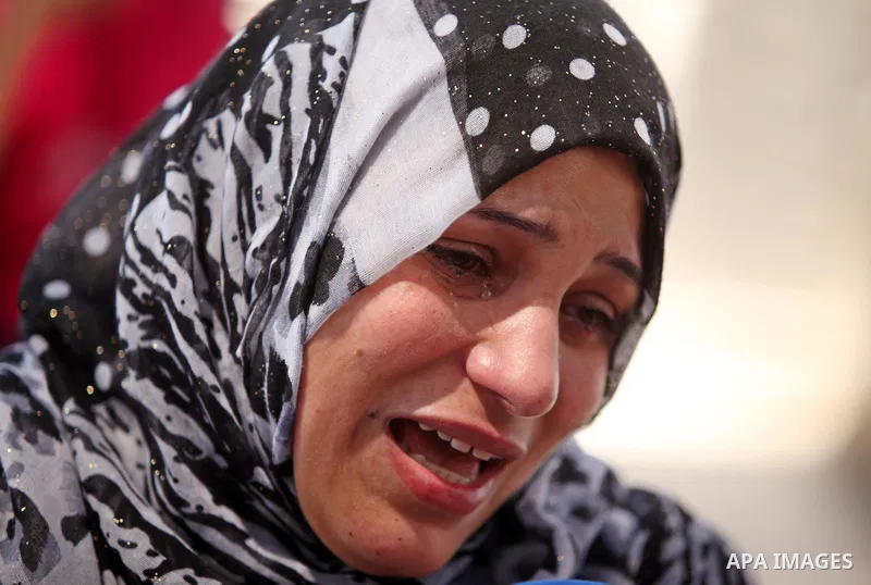 Palestinian families of abductees hold banners during a protest demanding released of four Palestinians were abducted in Egypt's Sinai Peninsula on Wednesday after the bus they were on was stopped by unidentified gunmen,...