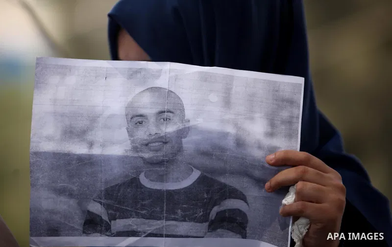 Palestinian families of abductees hold banners during a protest demanding released of four Palestinians were abducted in Egypt's Sinai Peninsula on Wednesday after the bus they were on was stopped by unidentified gunmen,...