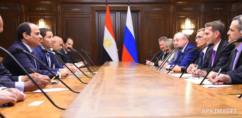 Egyptian President Abdel Fattah al-Sis speaks with Russian State Duma speaker Sergey Naryshkin, during a meeting at the State Duma, the lower house of parliament, in Moscow, Russia on August 25, 2015. Photo by Egyptian P...