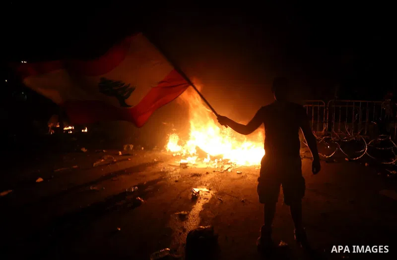 Lebanese protesters clash with security forces following a demonstration against the ongoing trash crisis on August 25, 2015, in front of the seat of the government in central Beirut. Lebanon's cabinet ended an acrimonio...