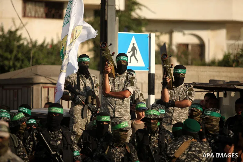 Palestinian militants of the Ezzedine al-Qassam Brigades, Hamas' armed wing, take part in a military parade in Gaza city on August 26, 2015. Photo by Ashraf Amra