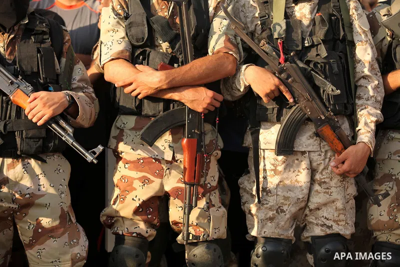 Palestinian militants of the Ezzedine al-Qassam Brigades, Hamas' armed wing, take part in a military parade in Gaza city on August 26, 2015. Photo by Ashraf Amra