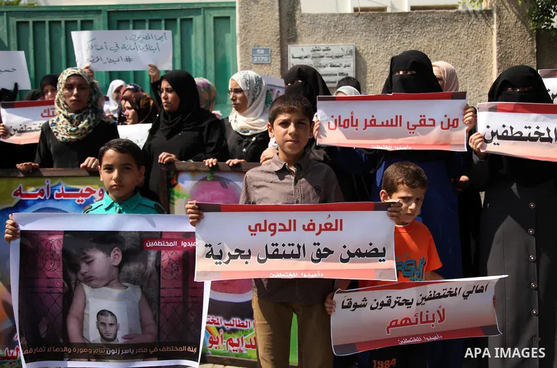 Families of Palestinians who were abducted of by gunmen is Egypt's Sinai's northern region, take part in a demonstration calling for the release in front of the Egyptian embassy, in Gaza city on August 27, 2015. Gunmen i...