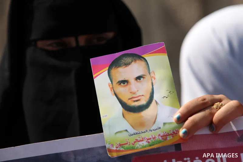 Families of Palestinians who were abducted of by gunmen is Egypt's Sinai's northern region, take part in a demonstration calling for the release in front of the Egyptian embassy, in Gaza city on August 27, 2015. Gunmen i...