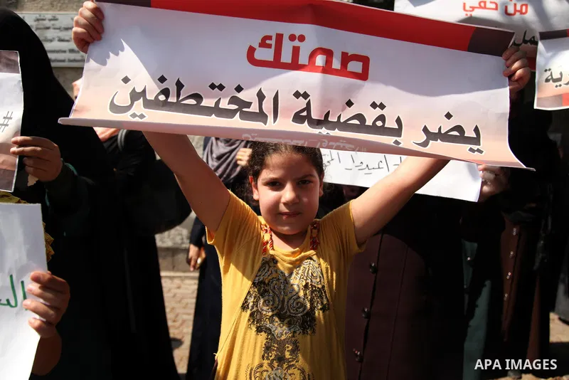 Families of Palestinians who were abducted of by gunmen is Egypt's Sinai's northern region, take part in a demonstration calling for the release in front of the Egyptian embassy, in Gaza city on August 27, 2015. Gunmen i...