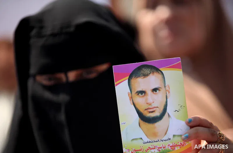 Families of Palestinians who were abducted of by gunmen is Egypt's Sinai's northern region, take part in a demonstration calling for the release in front of the Egyptian embassy, in Gaza city on August 27, 2015. Gunmen i...