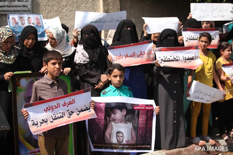 Families of Palestinians who were abducted of by gunmen is Egypt's Sinai's northern region, take part in a demonstration calling for the release in front of the Egyptian embassy, in Gaza city on August 27, 2015. Gunmen i...