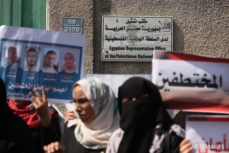 Families of Palestinians who were abducted of by gunmen is Egypt's Sinai's northern region, take part in a demonstration calling for the release in front of the Egyptian embassy, in Gaza city on August 27, 2015. Gunmen i...