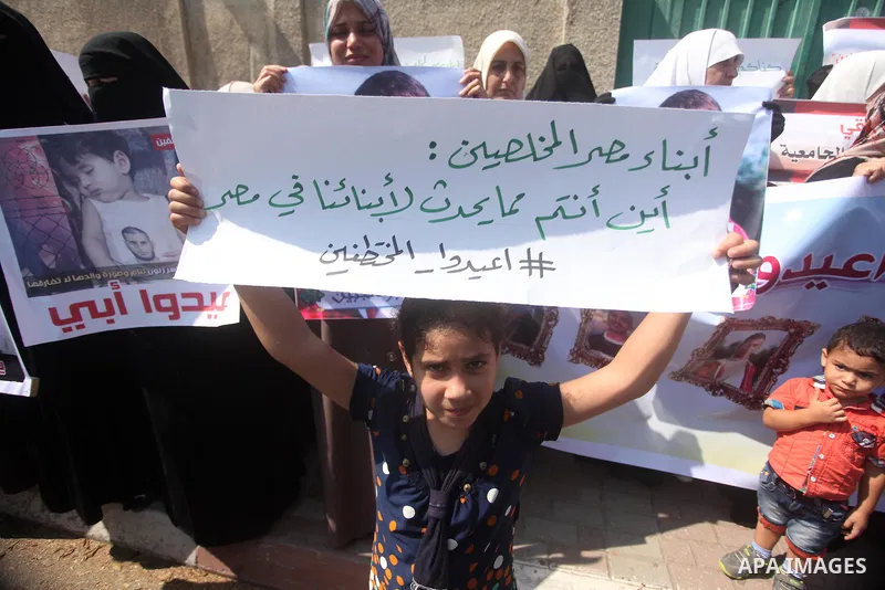 Families of Palestinians who were abducted of by gunmen is Egypt's Sinai's northern region, take part in a demonstration calling for the release in front of the Egyptian embassy, in Gaza city on August 27, 2015. Gunmen i...