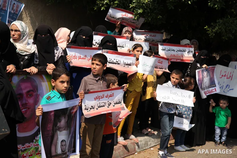 Families of Palestinians who were abducted of by gunmen is Egypt's Sinai's northern region, take part in a demonstration calling for the release in front of the Egyptian embassy, in Gaza city on August 27, 2015. Gunmen i...