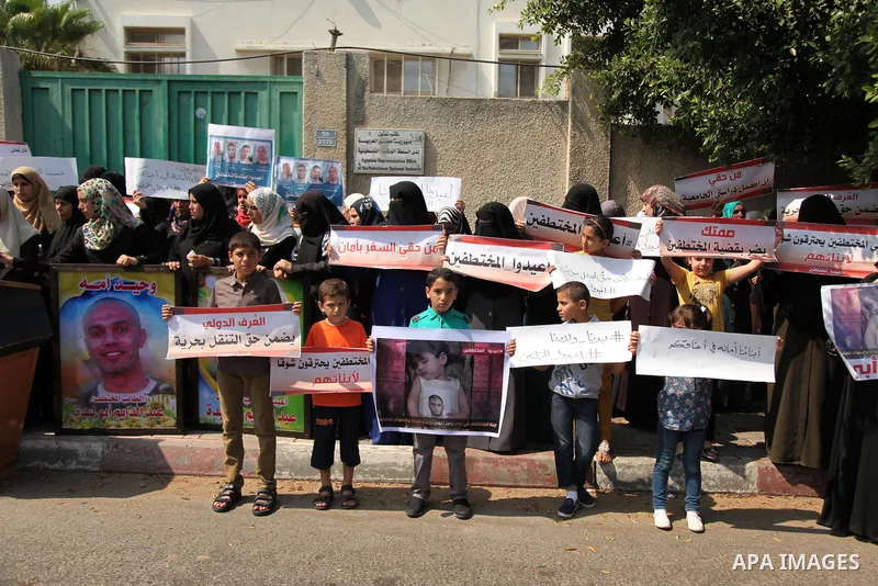 Families of Palestinians who were abducted of by gunmen is Egypt's Sinai's northern region, take part in a demonstration calling for the release in front of the Egyptian embassy, in Gaza city on August 27, 2015. Gunmen i...