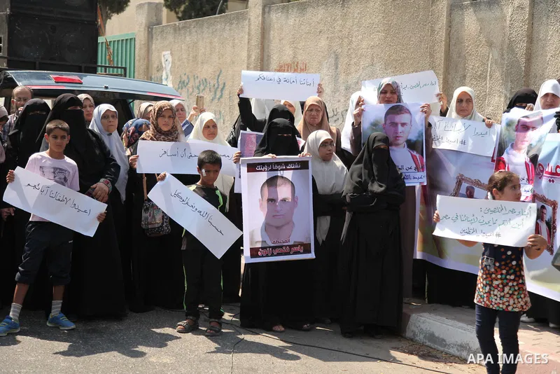 Families of Palestinians who were abducted of by gunmen is Egypt's Sinai's northern region, take part in a demonstration calling for the release in front of the Egyptian embassy, in Gaza city on August 27, 2015. Gunmen i...