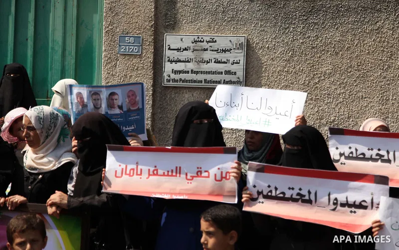 Families of Palestinians who were abducted of by gunmen is Egypt's Sinai's northern region, take part in a demonstration calling for the release in front of the Egyptian embassy, in Gaza city on August 27, 2015. Gunmen i...