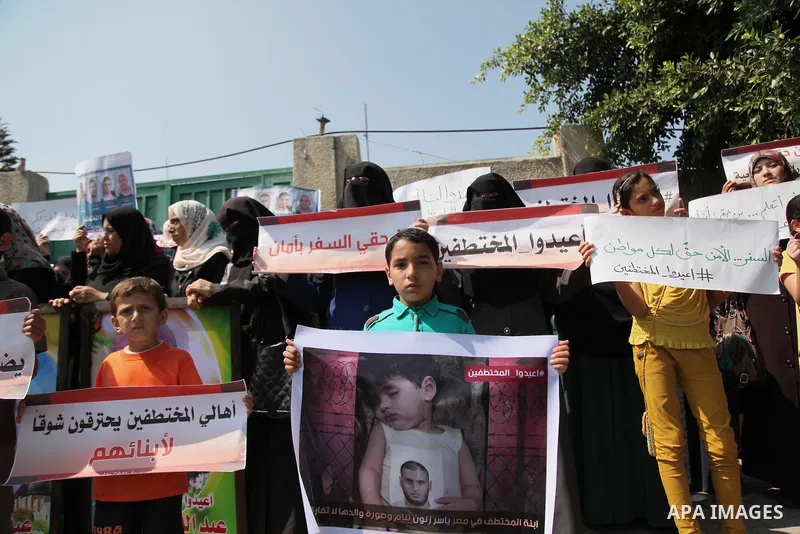 Families of Palestinians who were abducted of by gunmen is Egypt's Sinai's northern region, take part in a demonstration calling for the release in front of the Egyptian embassy, in Gaza city on August 27, 2015. Gunmen i...