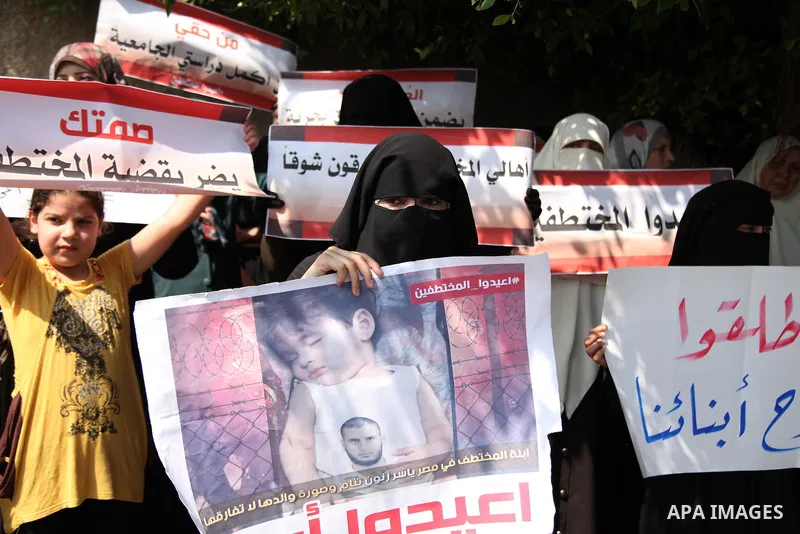Families of Palestinians who were abducted of by gunmen is Egypt's Sinai's northern region, take part in a demonstration calling for the release in front of the Egyptian embassy, in Gaza city on August 27, 2015. Gunmen i...