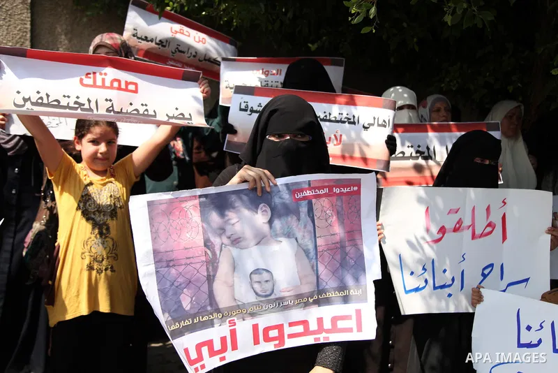 Families of Palestinians who were abducted of by gunmen is Egypt's Sinai's northern region, take part in a demonstration calling for the release in front of the Egyptian embassy, in Gaza city on August 27, 2015. Gunmen i...