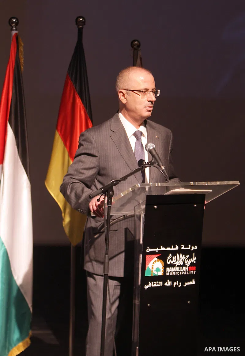 Palestinian Prime Minister Rami Hamdallah participates in the second forum of community accountability in Palestine, in the West Bank city of Ramallah on August 27, 2015. Photo by Prime Minister Office