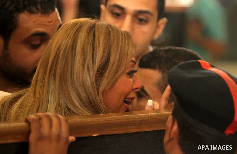Marwa Omara, wife of Al Jazeera television journalist Mohamed Fahmy, reacts at a court in Cairo, Egypt, August 29, 2015. An Egyptian court sentenced three Al Jazeera TV journalists to three years in prison on Saturday fo...