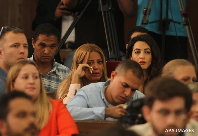 Marwa Omara, wife of Al Jazeera television journalist Mohamed Fahmy, reacts at a court in Cairo, Egypt, August 29, 2015. An Egyptian court sentenced three Al Jazeera TV journalists to three years in prison on Saturday fo...